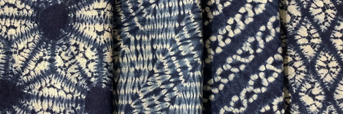 Indigo and white cloths dyed in the Japanese shibori fashion