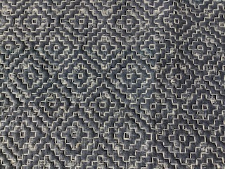 A piece of sashiko embroidery with intricate patterns.