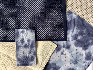 A piece of sashiko embroidery with intricate patterns.