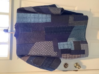 A piece of sashiko embroidery with intricate patterns.